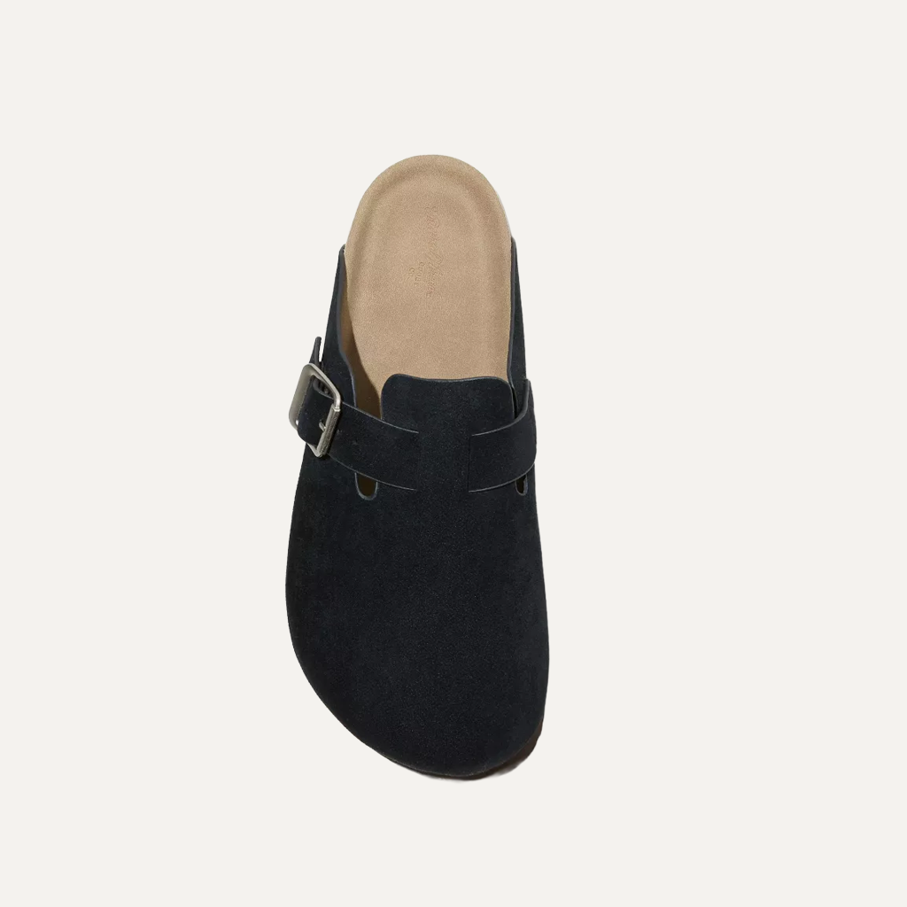 black cloggs on a white background