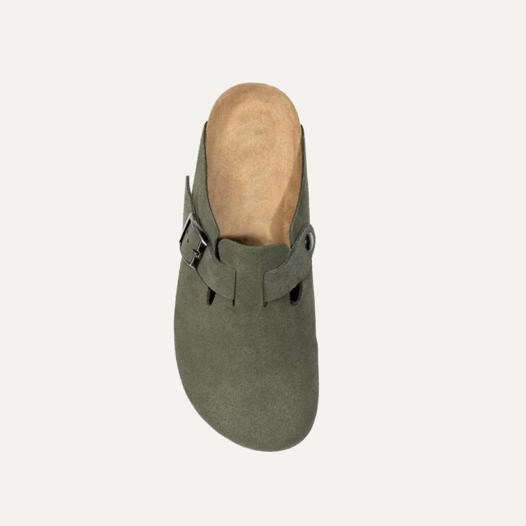 green cloggs on a white background